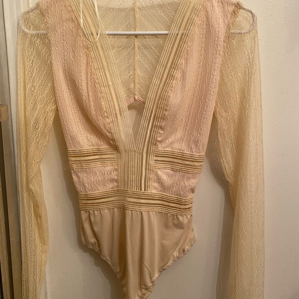 Cream colored bodysuit